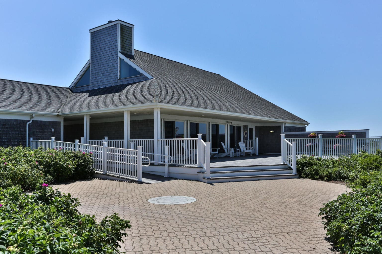 A large house with a porch and patio area.