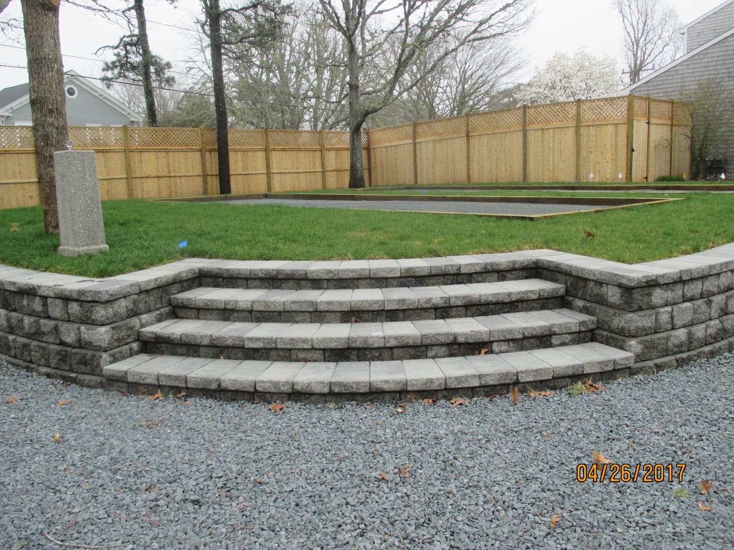 A stone wall with steps leading to the top.